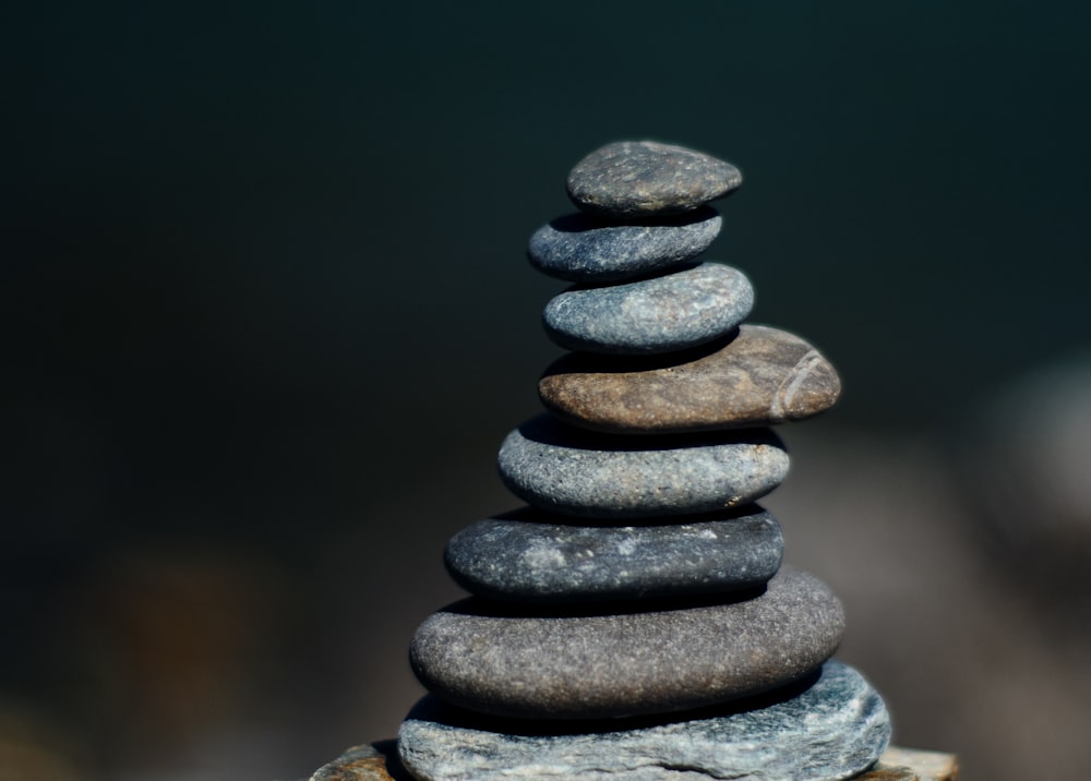 Artistic black and white photo of stacked stones symbolizing balance and stability.