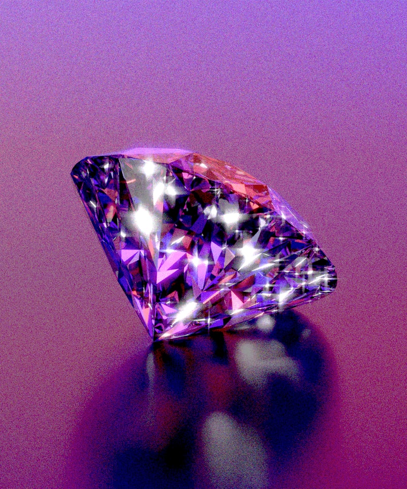 A sparkly diamond shines on a purple background.